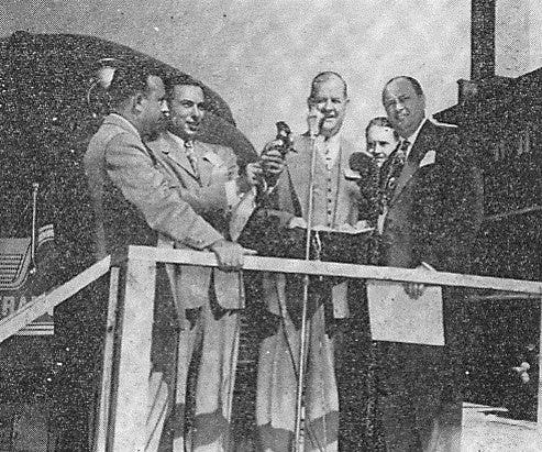 The new General motors Train of Tomorrow is in Springfield for public inspection. Approximately 140 guest of GM rode the train. GM received a special copy of a joint House-senate resolution commending the “Train of Tomorrow.” Regional director of PR for GM Osborn and state Sen. A.J. Bidwell made the presentation (left to right).